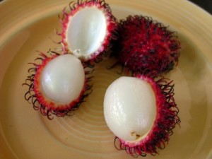 open rambutan fruit on a plate