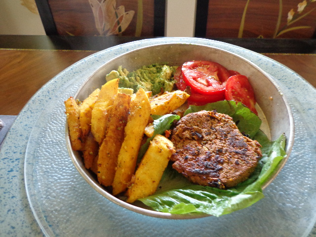 sprouted raw vegan black bean burgers with jicama fries, avocado and tomatoes