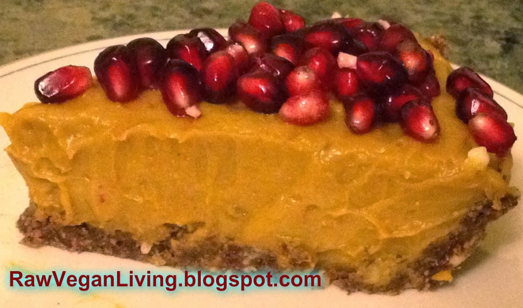 raw vegan pumpkin pie topped with pomegranate seeds