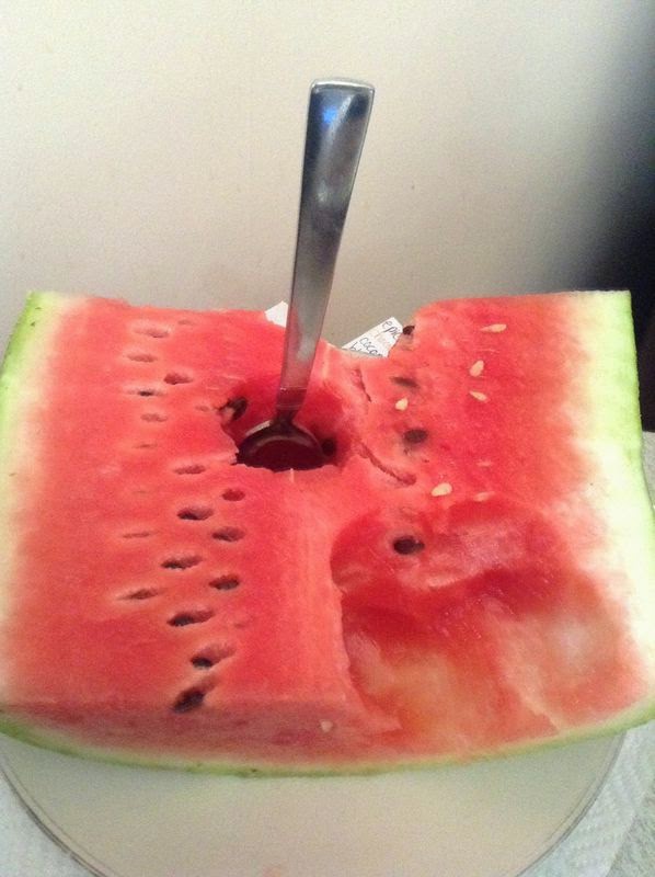 eating watermelon with a spoon